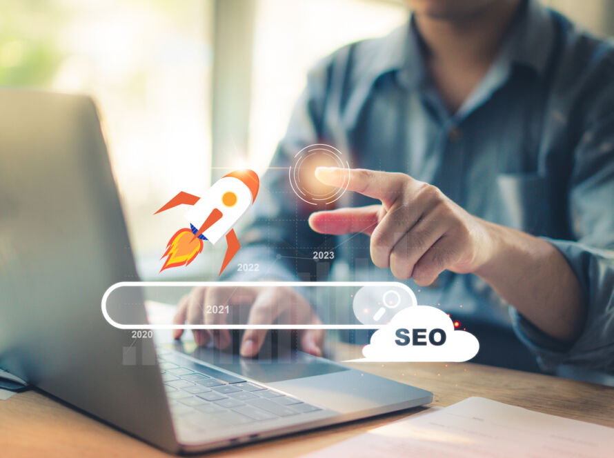 Marketer using a laptop to analyze SEO performance and if their website follows Google E-E-A-T guidelines