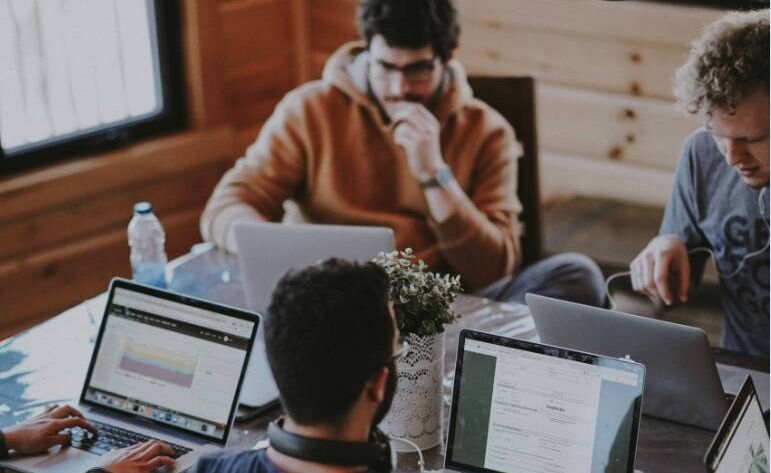 Co-workers collaborating on what technical SEO and on-page SEO