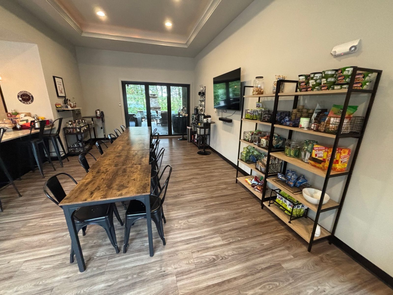 Snack shelves and communal tables in the Relevance Café