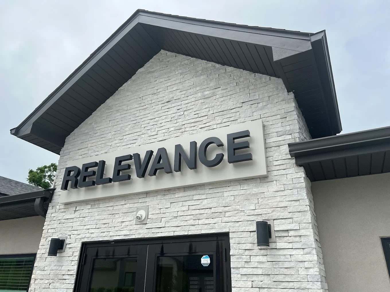 Relevance sign on the front of the Relevance office