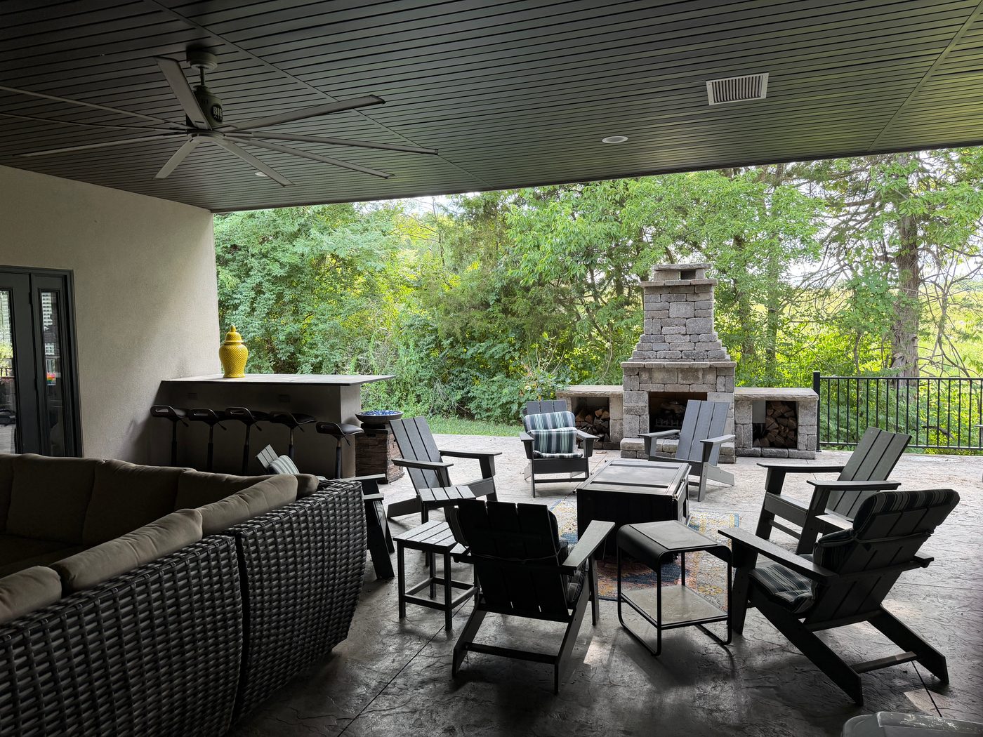 Covered patio with stone fireplace at Common Good Coworking in Columbia, Missouri